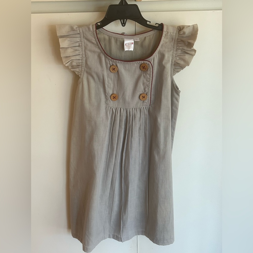 Brand new with tag size 7 girls dress by Yo Baby.